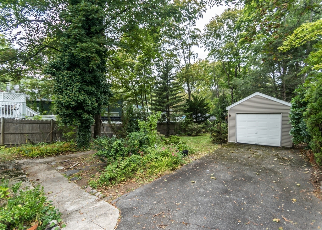37 Summit Street Waltham, MA 02451 - Photo 27 of 29 a front view of a house with a yard and trees