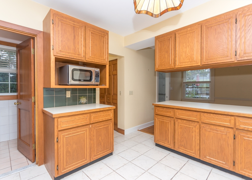 37 Summit Street Waltham, MA 02451 - Photo 9 of 29 a kitchen with granite countertop a stove and a sink