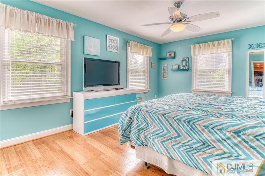 85 Davidson's Mill Road North Brunswick, NJ 08902 - Photo 27 of 39 a bedroom with a bed and a flat screen tv