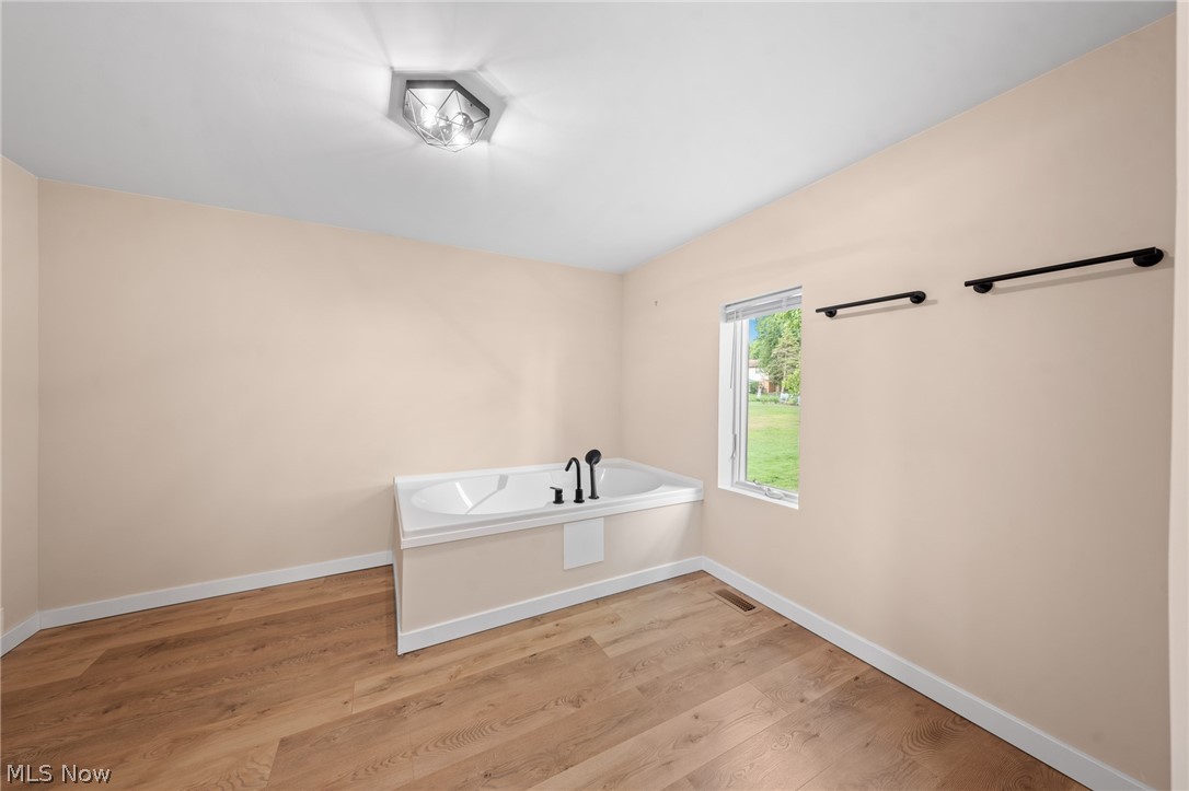 1617 Graham Road Stow, OH 44224 - Photo 31 of 49 Bathroom with a washtub and wood-type flooring