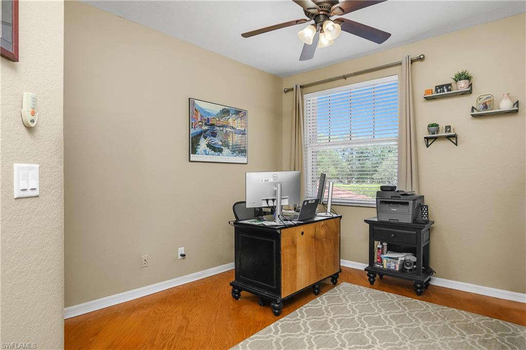 680 Lalique Circle, Unit 1205 Naples, FL 34119 - Photo 16 of 32 a view of a workspace with furniture and a window