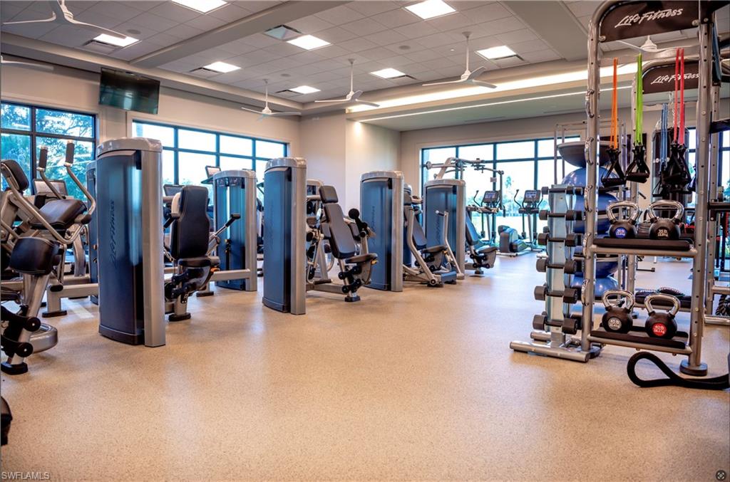 680 Lalique Circle, Unit 1205 Naples, FL 34119 - Photo 24 of 32 a view of a room with gym equipment