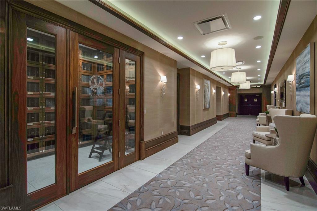680 Lalique Circle, Unit 1205 Naples, FL 34119 - Photo 27 of 32 a lobby with furniture and a hallway