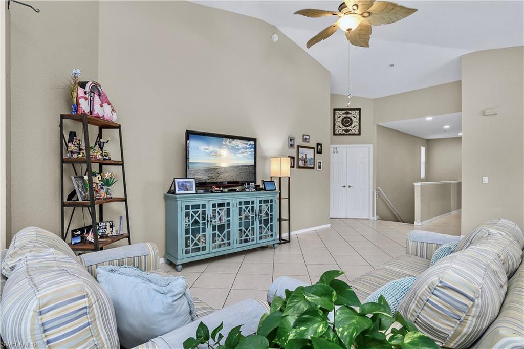 680 Lalique Circle, Unit 1205 Naples, FL 34119 - Photo 9 of 32 a bedroom with furniture and a flat screen tv