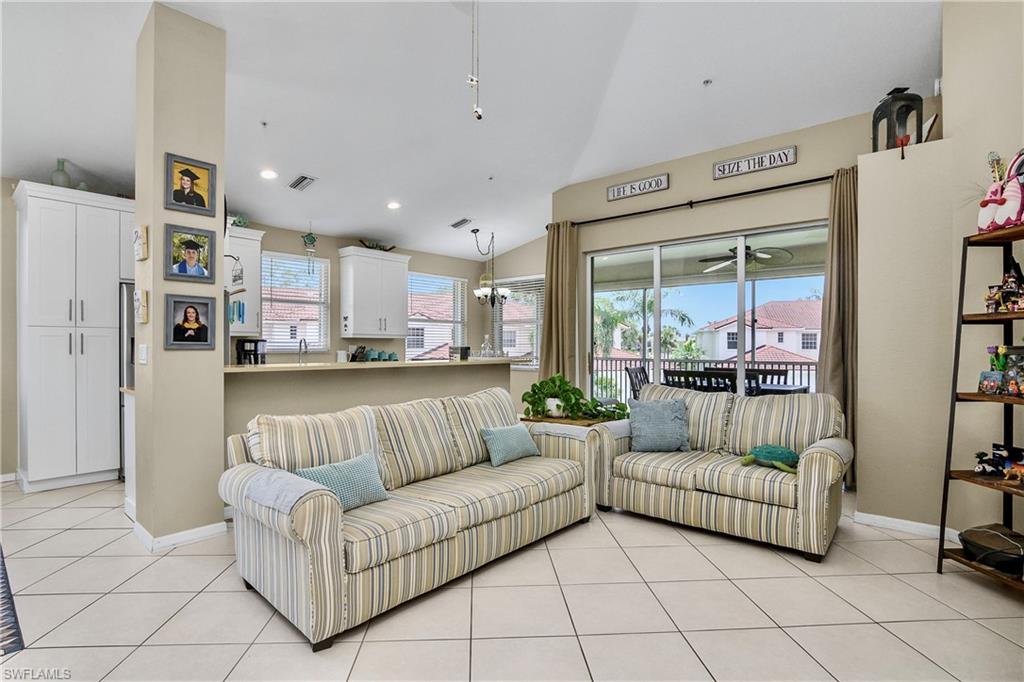 680 Lalique Circle, Unit 1205 Naples, FL 34119 - Photo 10 of 32 a living room with furniture and a couch