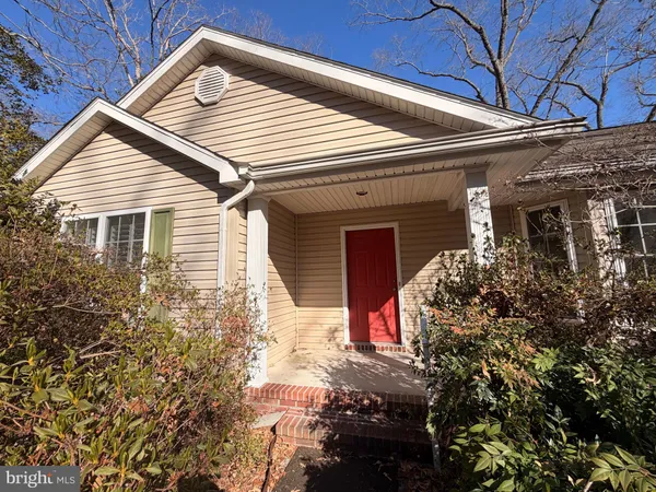 a front view of house with an outdoor space
