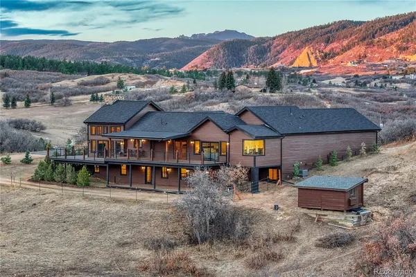 an aerial view of a town with big yard