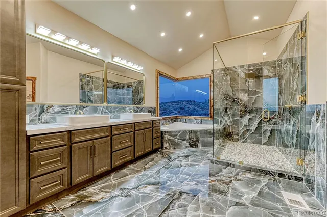 a spacious bathroom with a double vanity sink a mirror and a shower