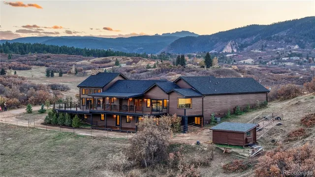 a view of a house and a yard and garden