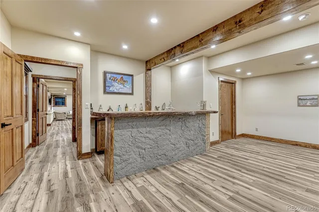 a spacious bedroom with a bed and a couch