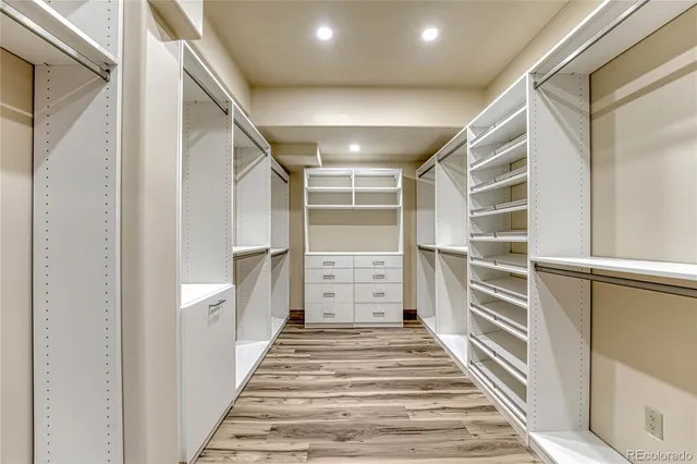a spacious bathroom with a granite countertop sink a toilet and shower