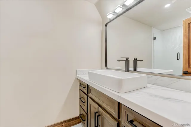 a bathroom with a bathtub and shower