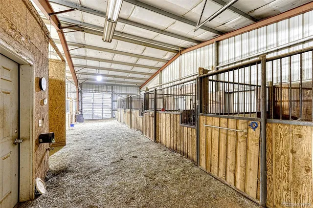 a view of an empty room with a fireplace