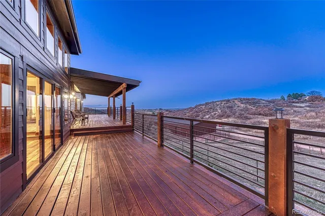 a view of a balcony with wooden floor