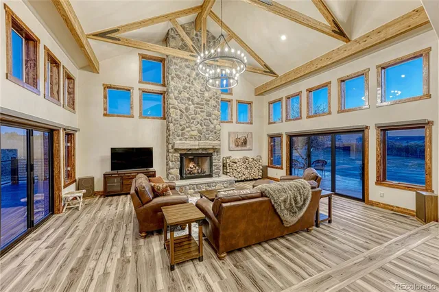 a view of a house with barbeque oven and furniture