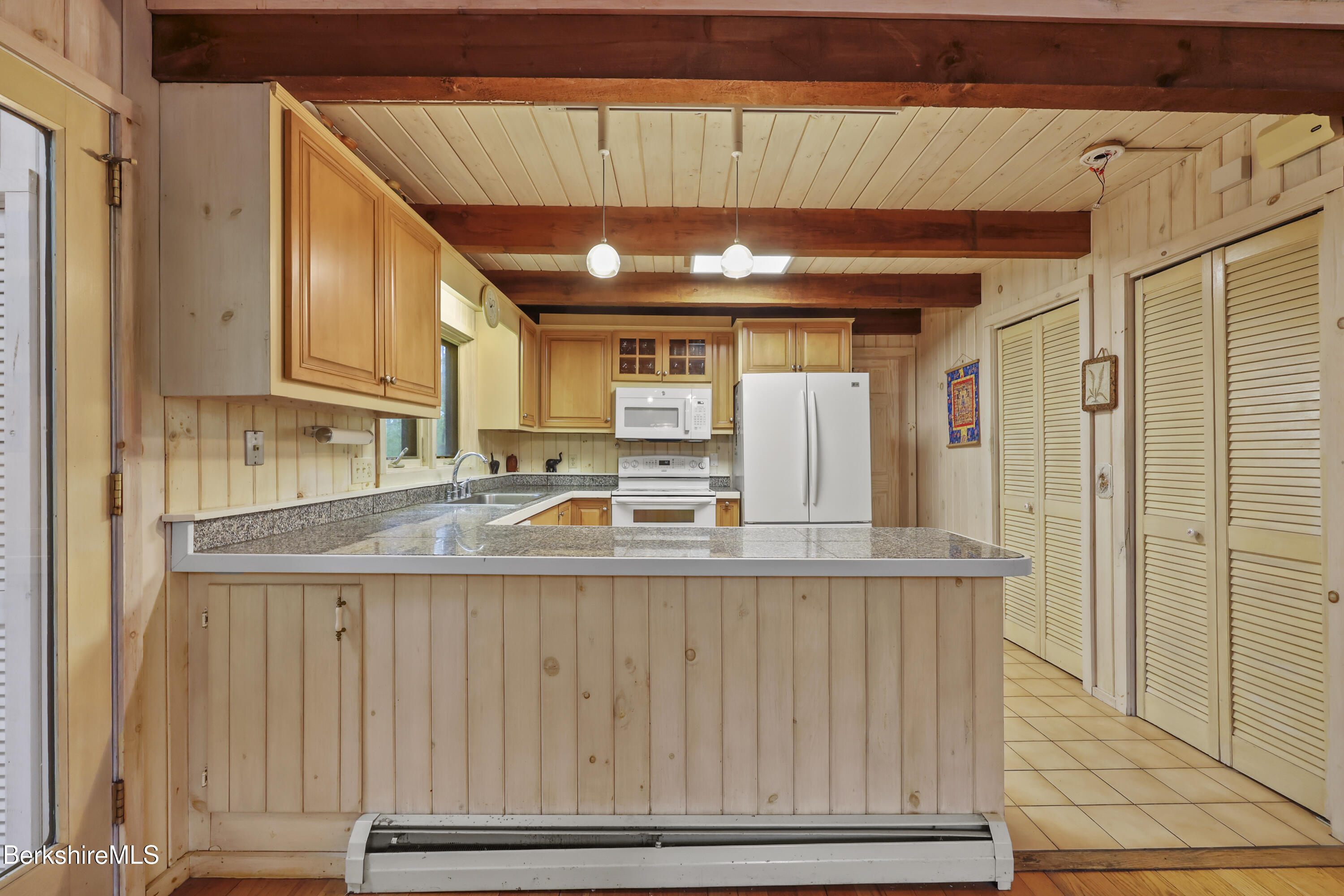 422 Bonny Rigg Hill Road Becket, MA 01223 - Photo 14 of 60 a kitchen with kitchen island granite countertop a sink and cabinets
