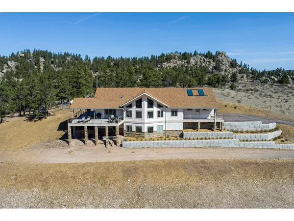 a view of a big house with a big yard