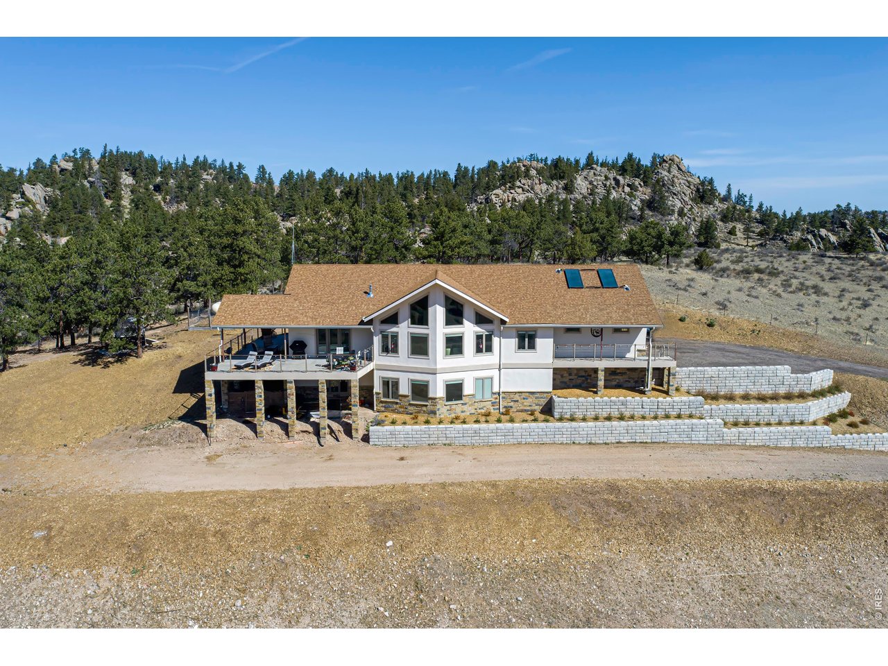 a view of a big house with a big yard