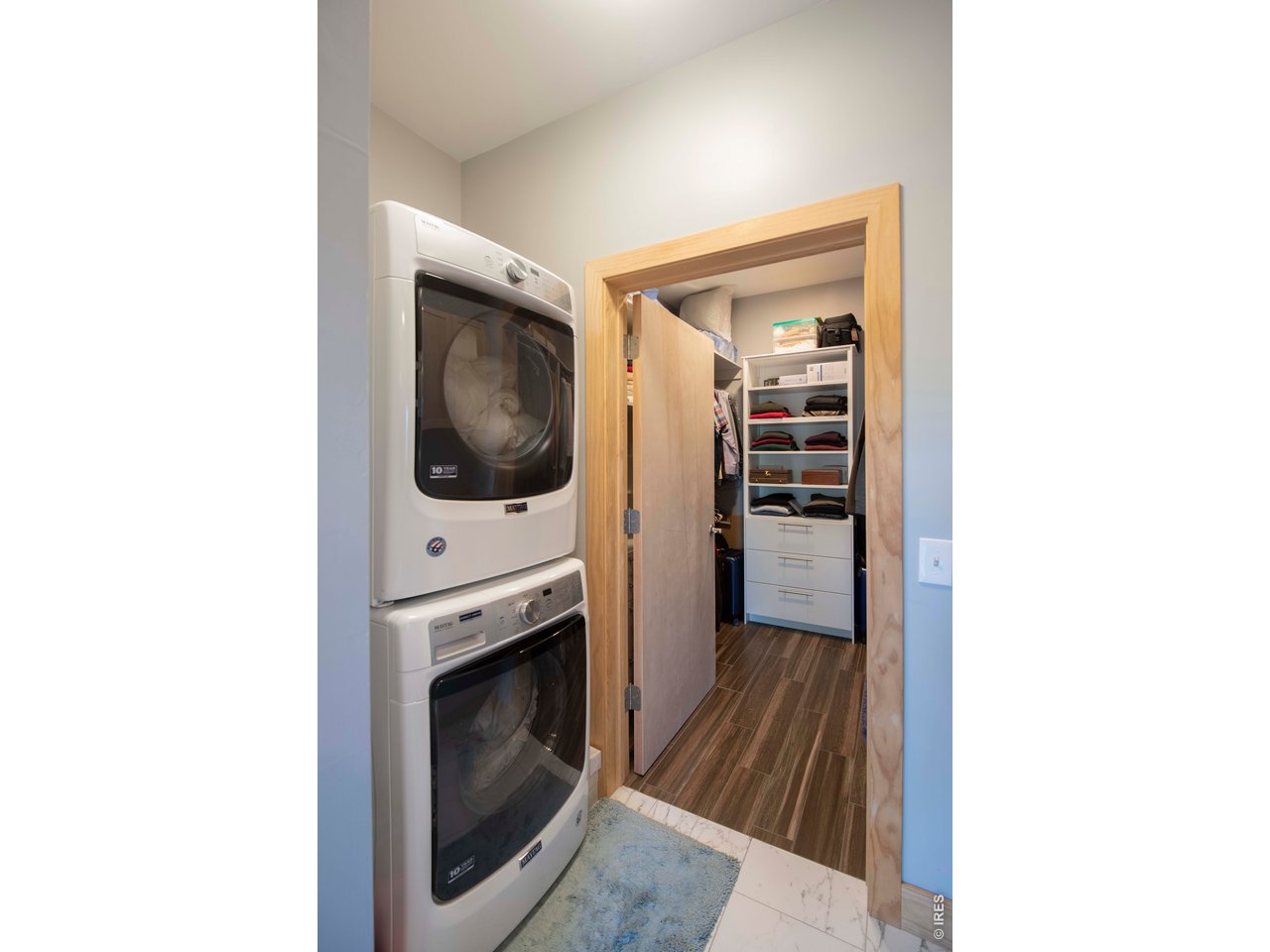 91 Eagle Rising Place Livermore, CO 80536 - Photo 15 of 38 a hallway with washer and dryer