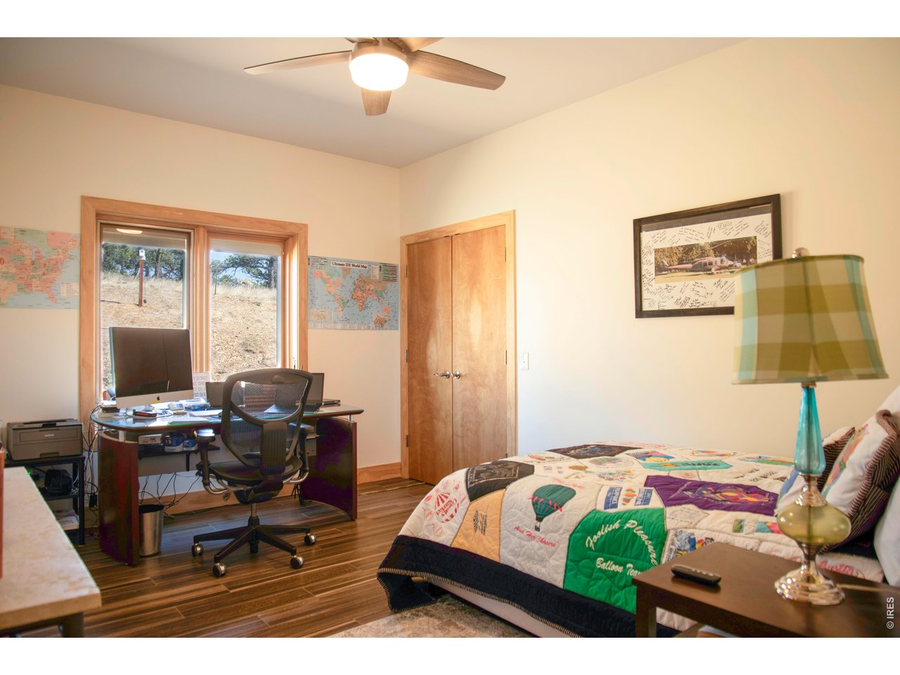 91 Eagle Rising Place Livermore, CO 80536 - Photo 19 of 38 a bedroom that has a bed and a desk