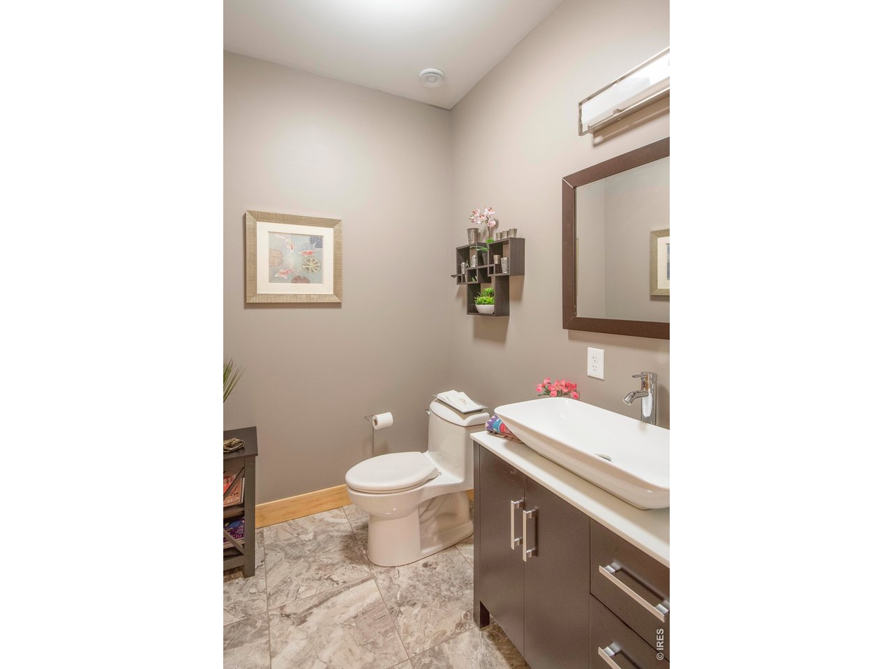 91 Eagle Rising Place Livermore, CO 80536 - Photo 20 of 38 a bathroom with a sink toilet and mirror