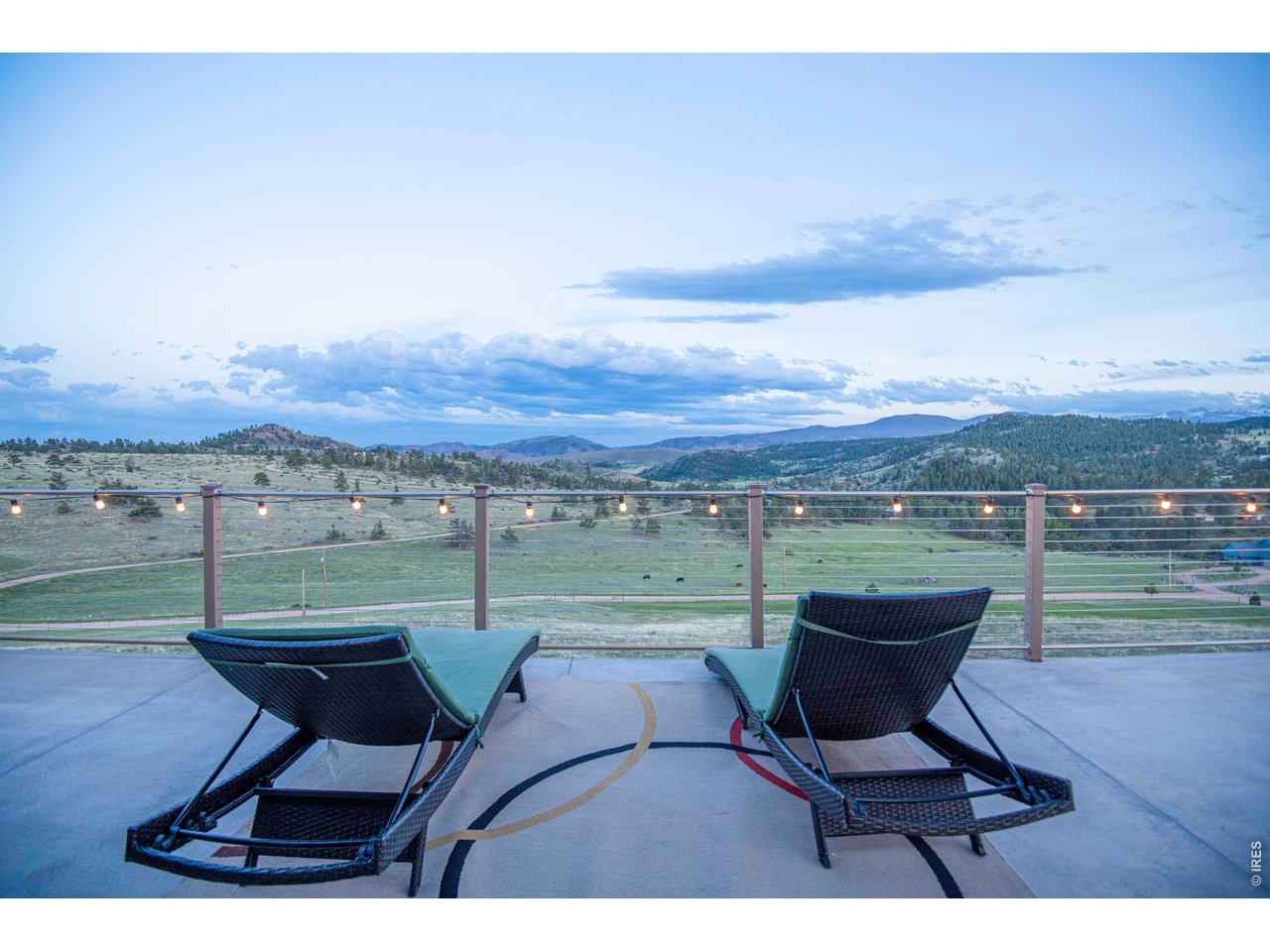 91 Eagle Rising Place Livermore, CO 80536 - Photo 28 of 38 a view of a terrace with a table and chairs
