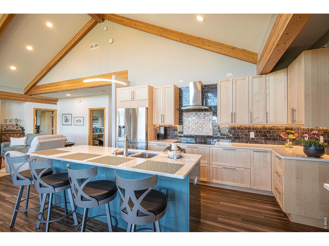 91 Eagle Rising Place Livermore, CO 80536 - Photo 4 of 38 a kitchen with a sink and chairs