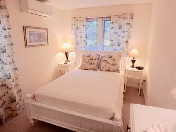 a bedroom with a bed and a couch