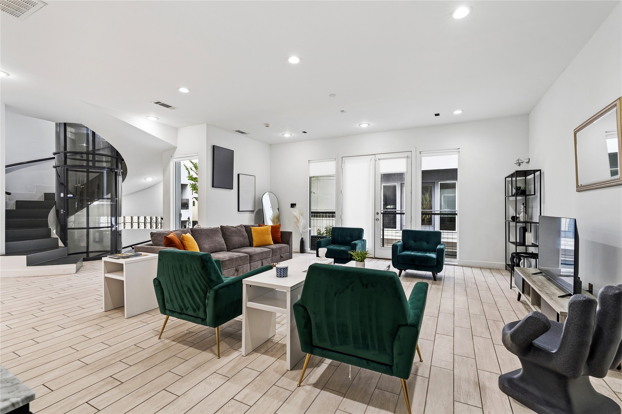 a living room with lots of furniture and kitchen view