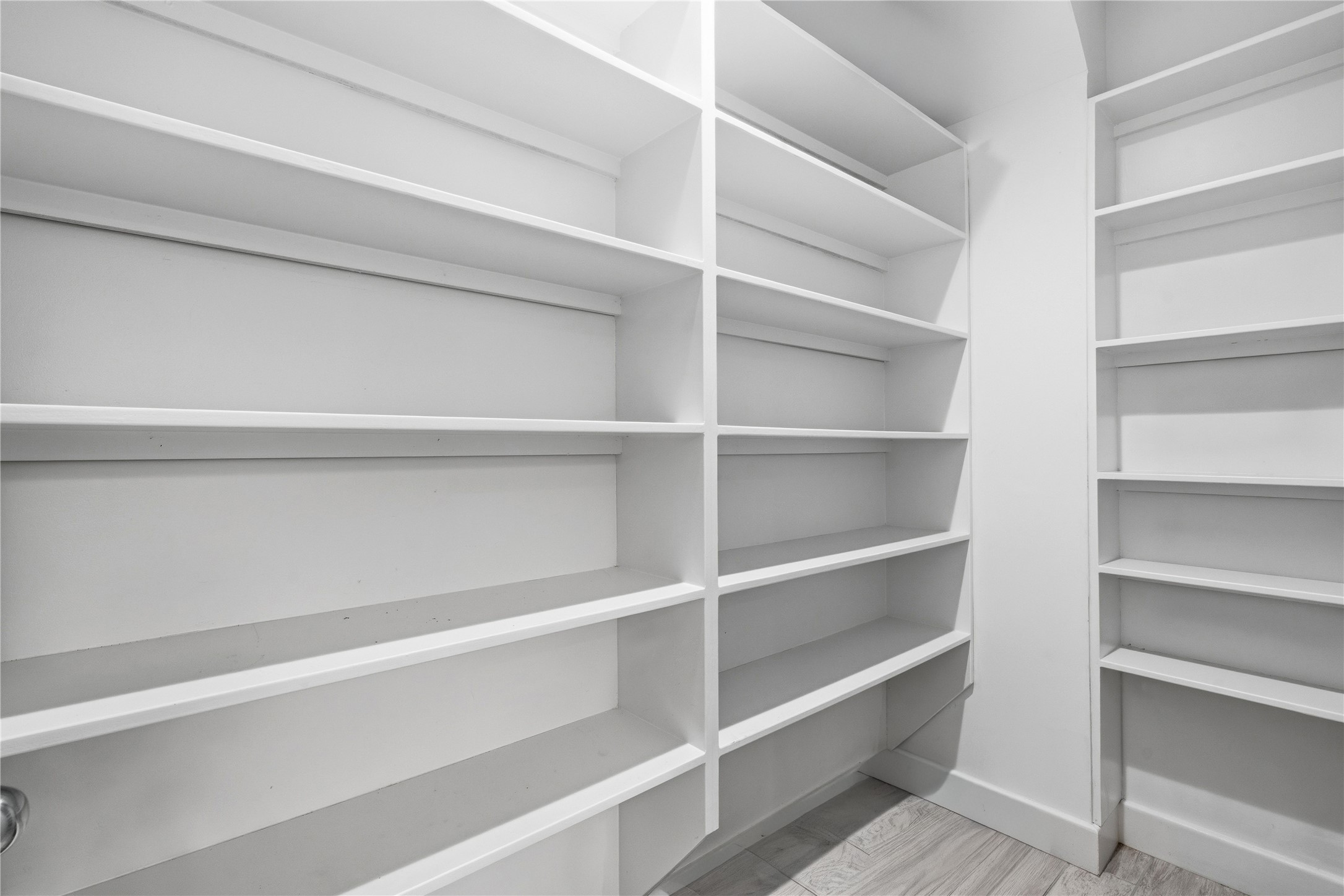 2025 Colquitt Street, Unit A Houston, TX 77098 - Photo 14 of 40 a view of walk in closet with empty racks
