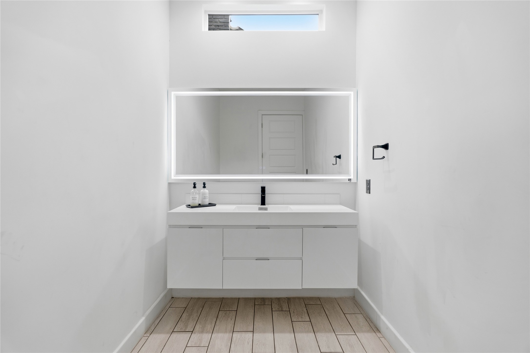 2025 Colquitt Street, Unit A Houston, TX 77098 - Photo 22 of 40 a bathroom with a sink and a mirror
