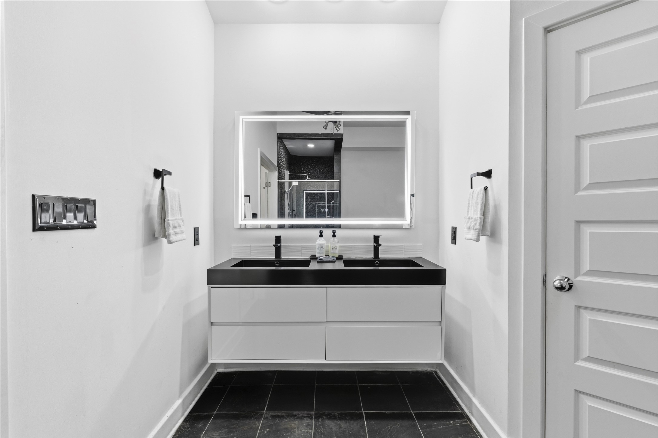 2025 Colquitt Street, Unit A Houston, TX 77098 - Photo 27 of 40 a bathroom with a sink and a mirror