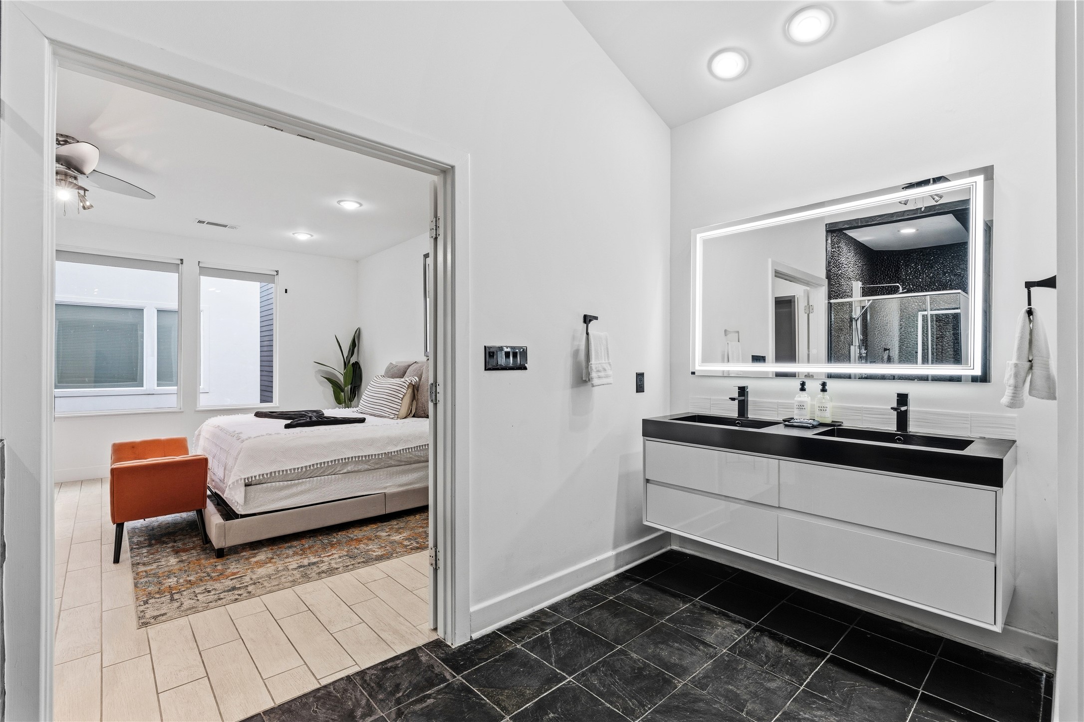 2025 Colquitt Street, Unit A Houston, TX 77098 - Photo 28 of 40 a en suite spacious bathroom with a double vanity sink and mirror