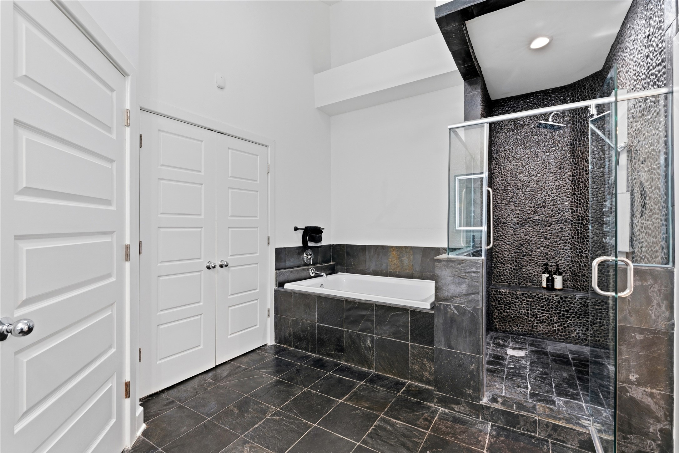 2025 Colquitt Street, Unit A Houston, TX 77098 - Photo 29 of 40 a bathroom with a bathtub and shower