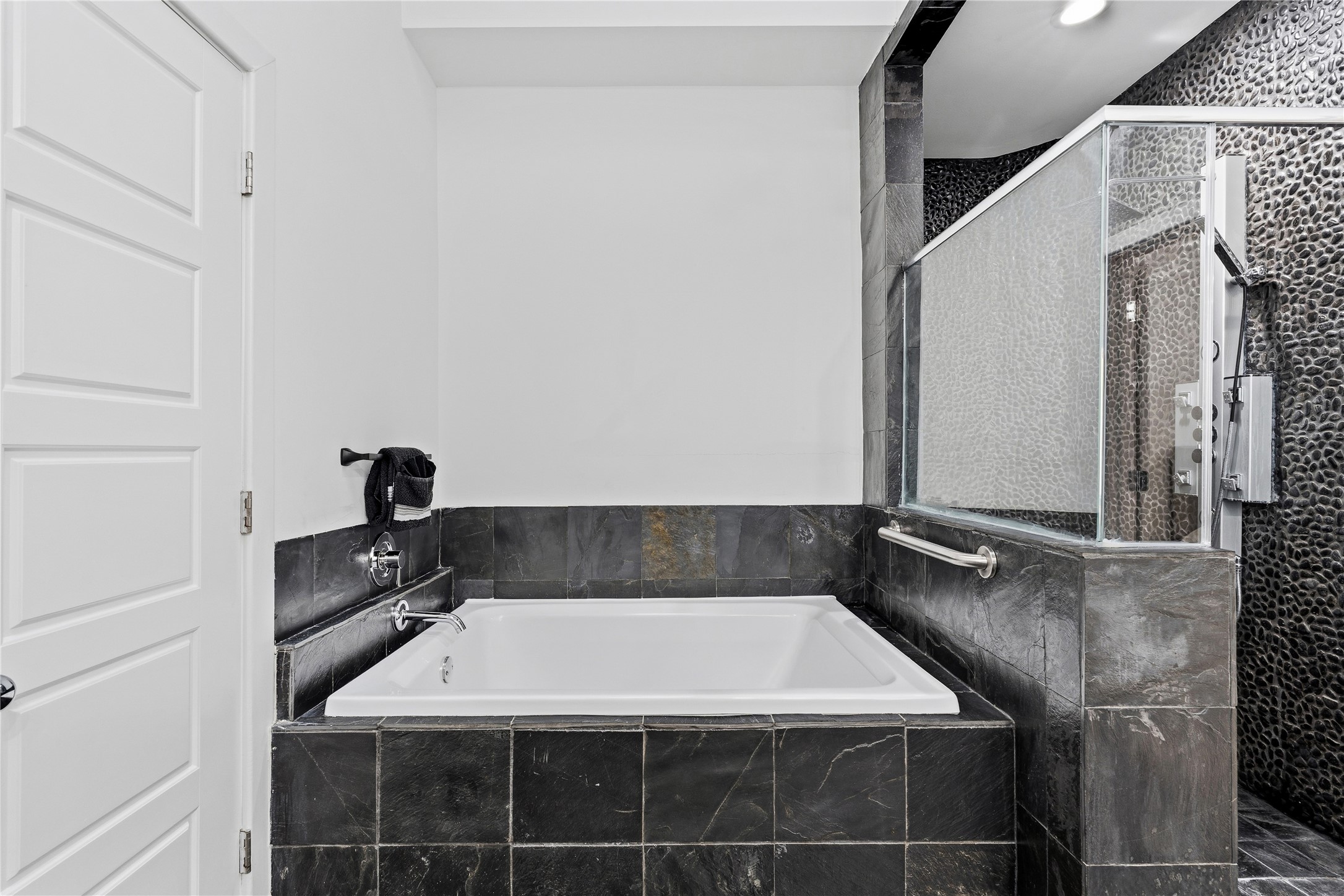 2025 Colquitt Street, Unit A Houston, TX 77098 - Photo 30 of 40 a bathroom with a bathtub and shower