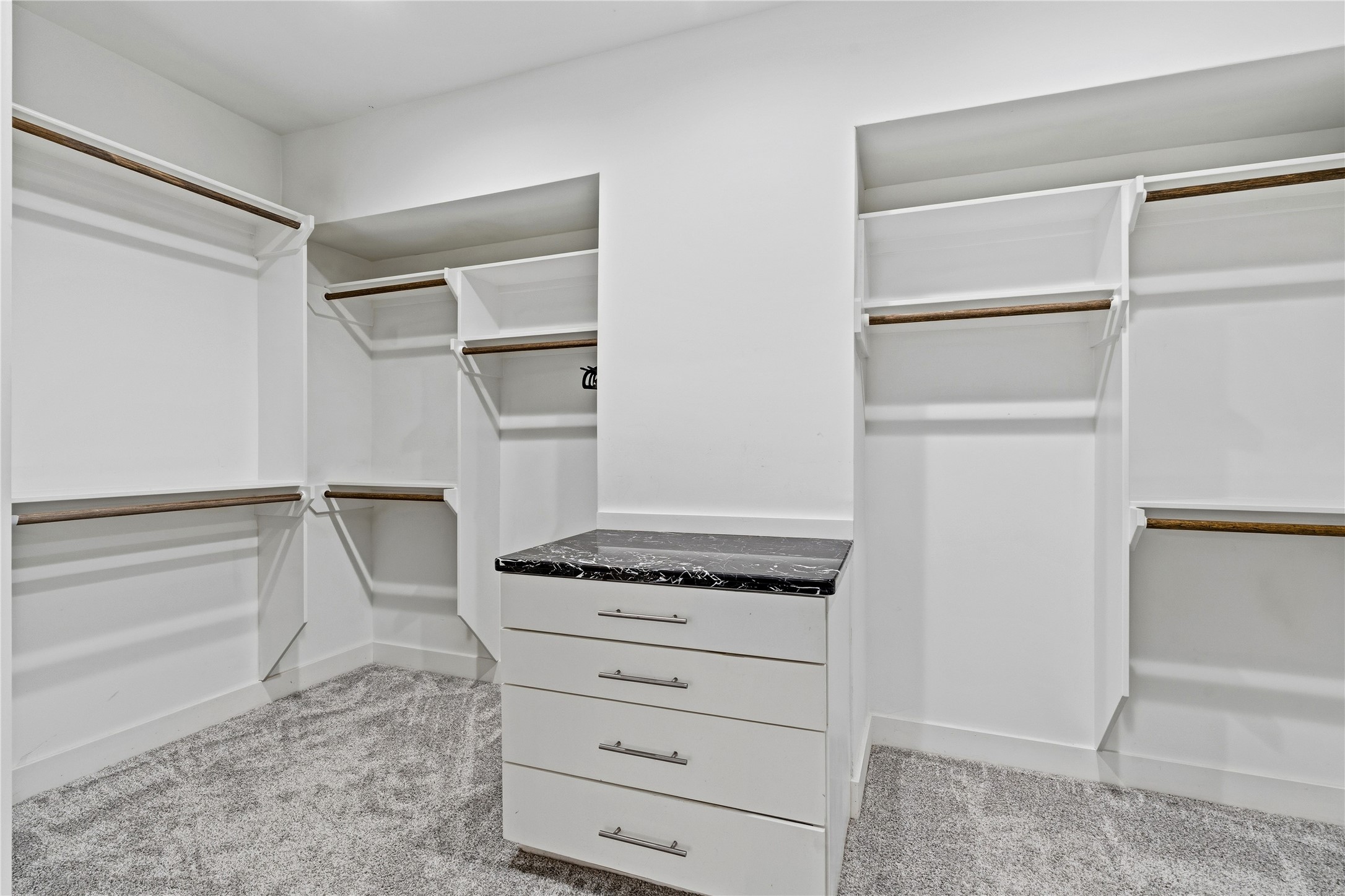 2025 Colquitt Street, Unit A Houston, TX 77098 - Photo 31 of 40 a view of walk in closet with empty racks