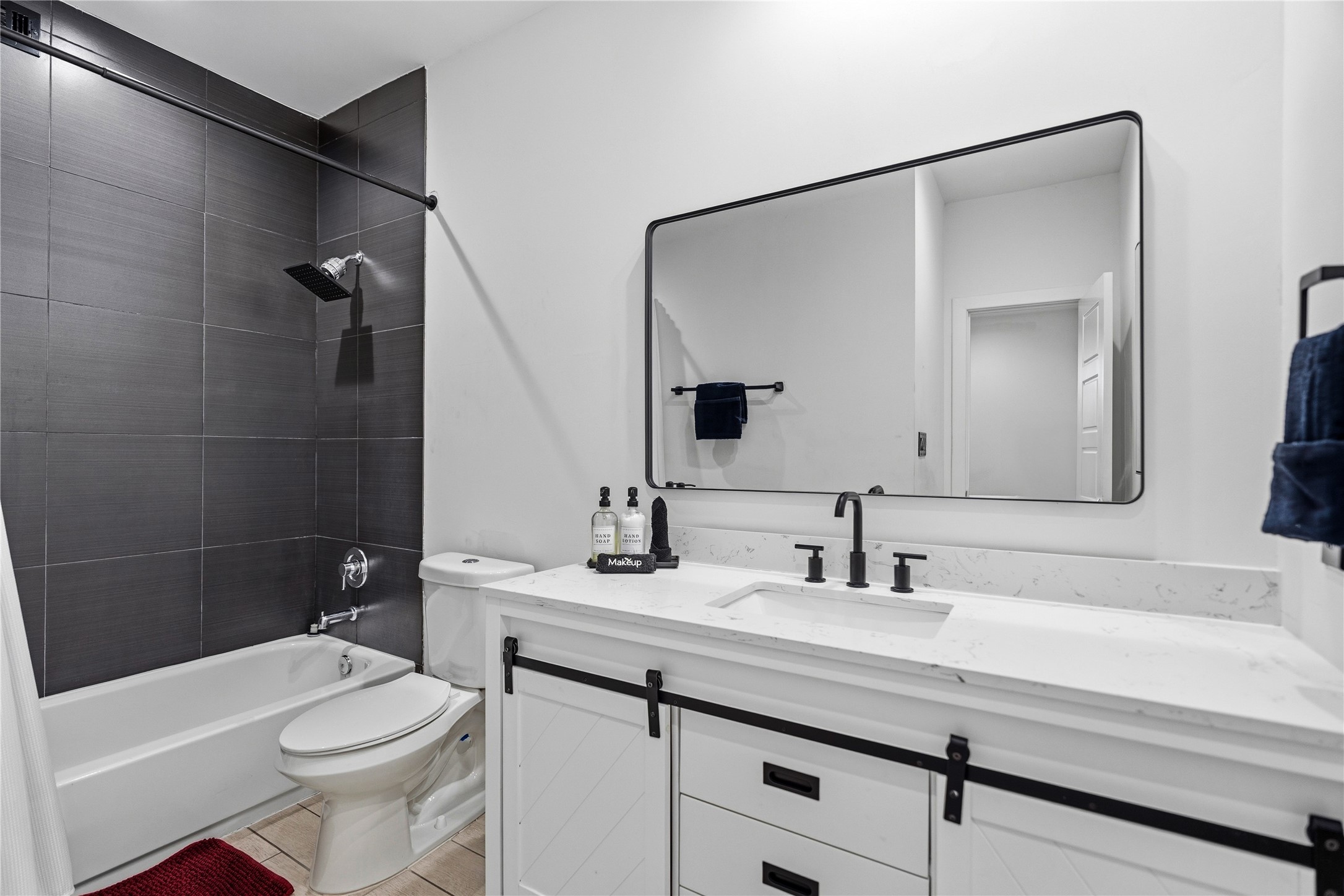 2025 Colquitt Street, Unit A Houston, TX 77098 - Photo 34 of 40 a bathroom with a sink a toilet and shower
