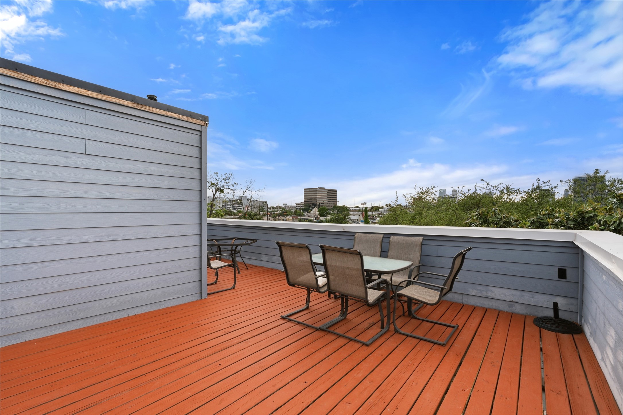 2025 Colquitt Street, Unit A Houston, TX 77098 - Photo 36 of 40 a view of balcony with furniture and wooden floor