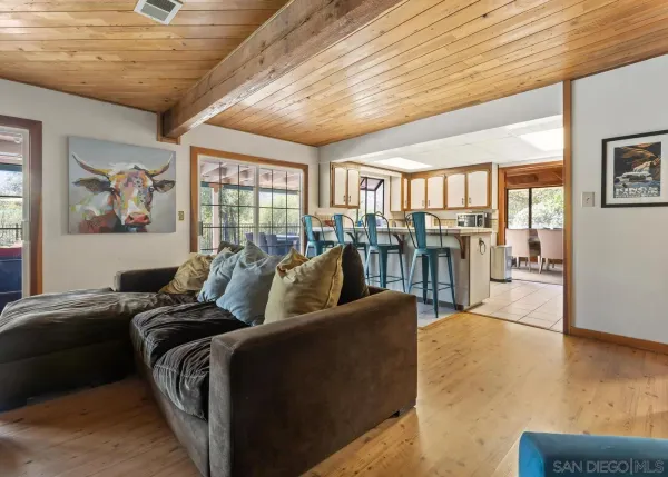 a view of a livingroom with furniture and a ceiling fan