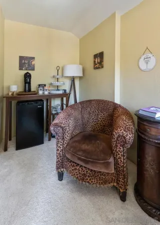 a living room with furniture and a lamp