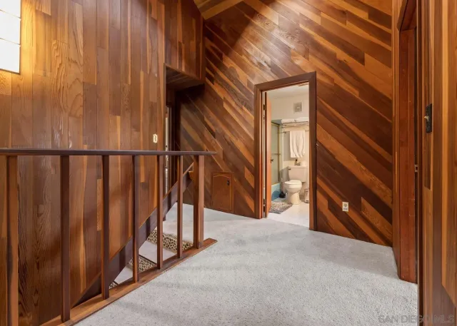 a view of a porch with wooden floor and stairs
