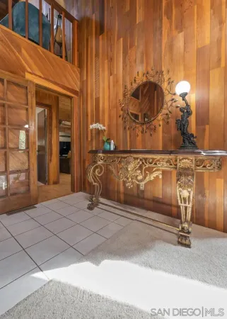 a bathroom with a toilet and a mirror