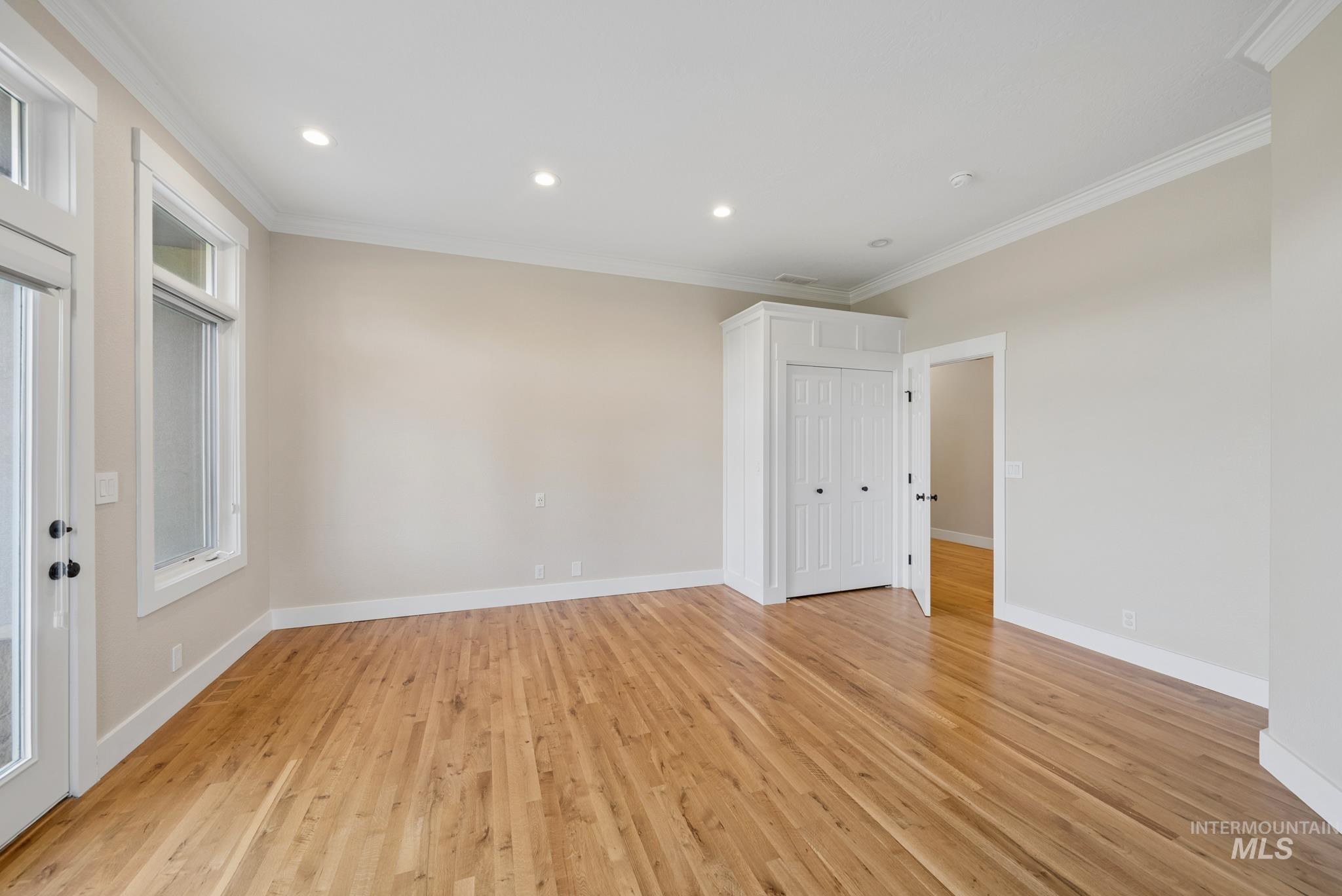 2050 Artesian Road Eagle, ID 83616 - Photo 46 of 49 Spacious room featuring wood-finish flooring, recessed lighting, and crown molding