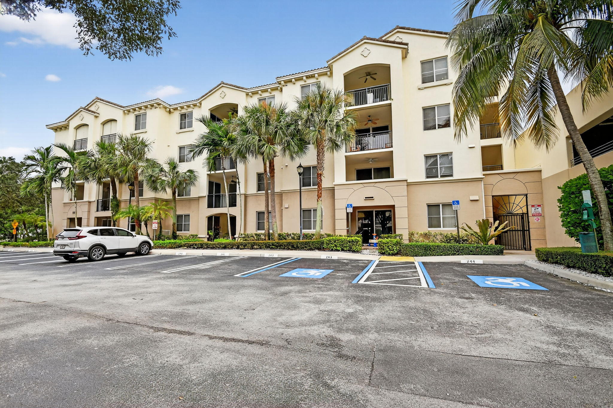 1 Renaissance Way, Unit 116 Boynton Beach, FL 33426 - Photo 1 of 34 a front view of a building with parking area