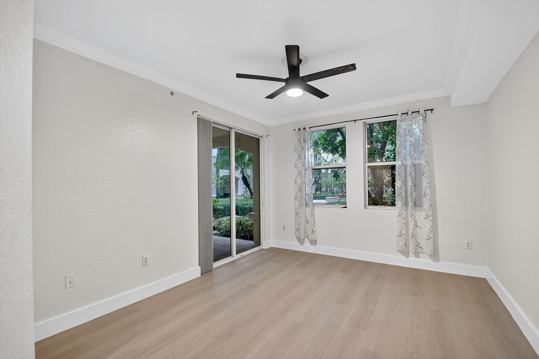 1 Renaissance Way, Unit 116 Boynton Beach, FL 33426 - Photo 14 of 34 a view of a livingroom with a ceiling fan and window