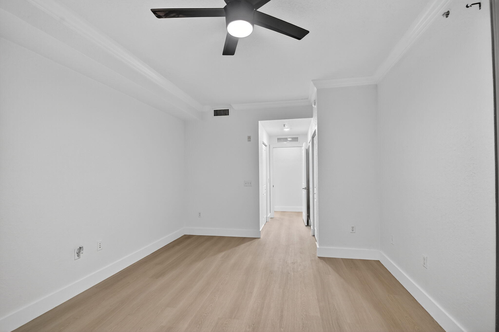 1 Renaissance Way, Unit 116 Boynton Beach, FL 33426 - Photo 16 of 34 an empty room with a empty space and a ceiling fan