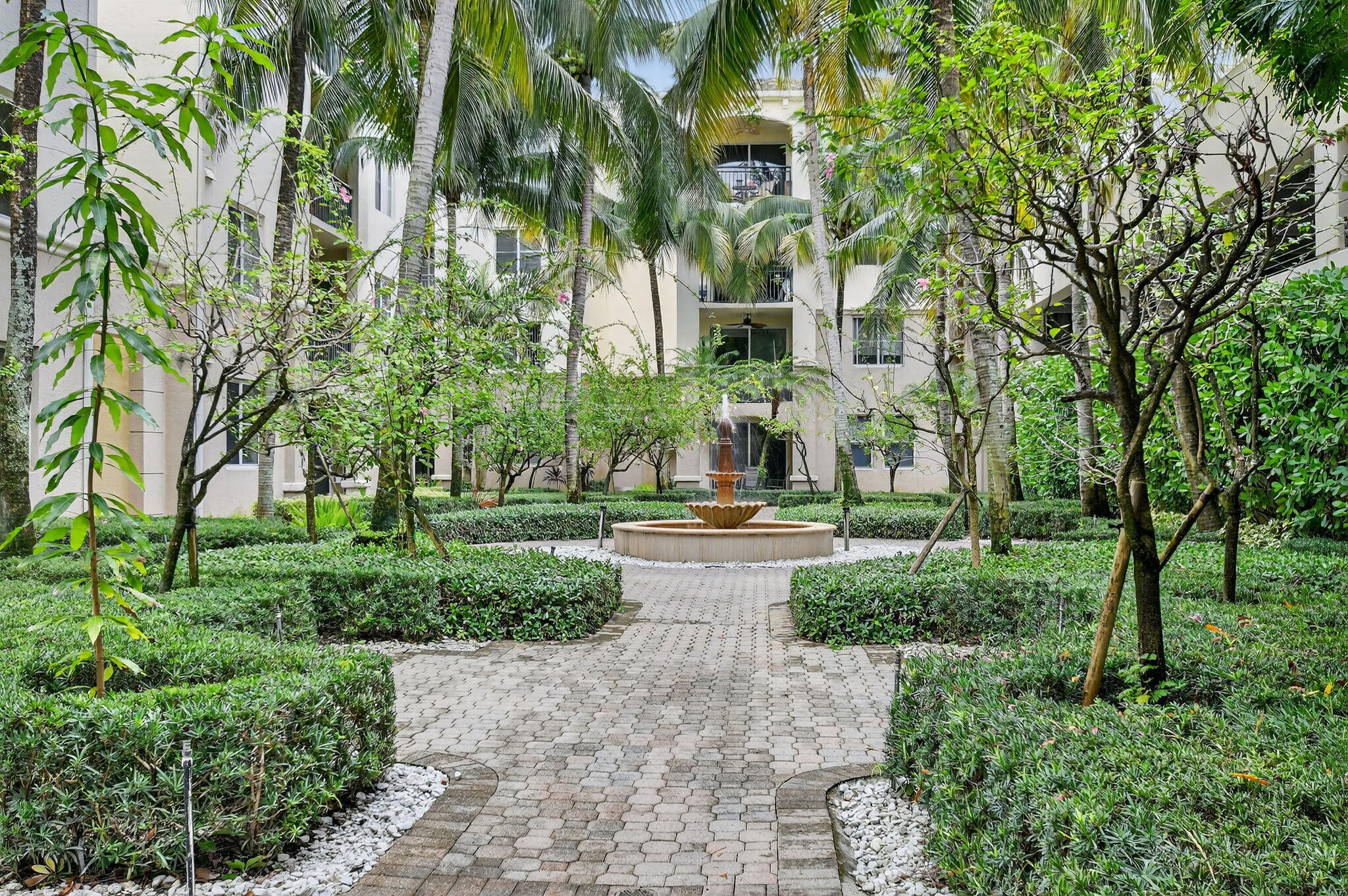 1 Renaissance Way, Unit 116 Boynton Beach, FL 33426 - Photo 30 of 34 a building view with a garden