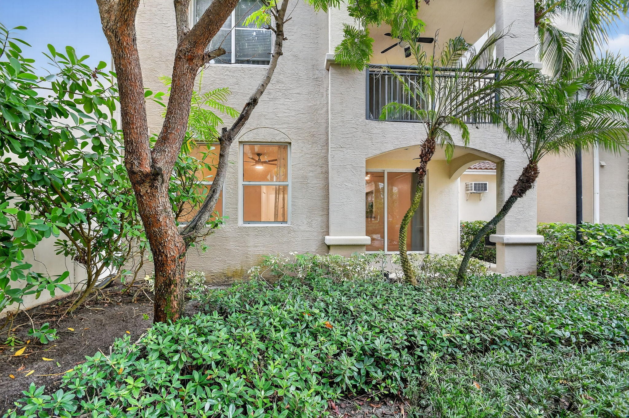 1 Renaissance Way, Unit 116 Boynton Beach, FL 33426 - Photo 33 of 34 a front view of a house with a garden