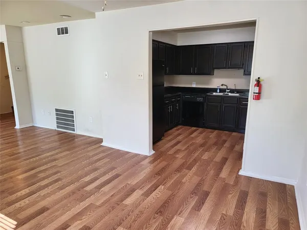 a view of kitchen and wooden floor