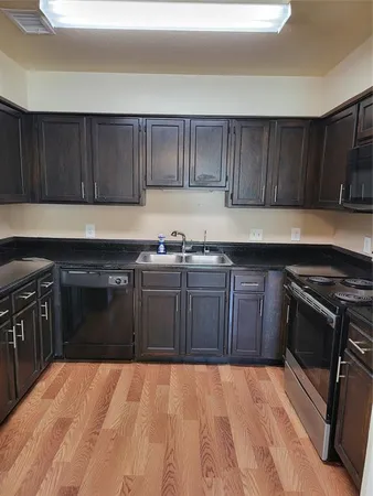 a kitchen with a sink and a stove